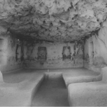 Interior of artificial cave at Ras il-Wardija. Photo taken during 1960s excavations. Rock-cut U-shaped ‘bench’ running along the walls no longer exists