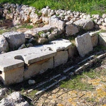 Public toilet at Mgarr-Ghajn Tuffieha Roman Baths. The stone seating-slabs could be lifted to inspect, clean or add soil to cover the dirt beneath.