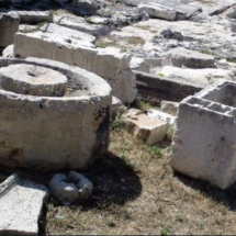 Stone press and storage receptacle at the Domvs Romana archaeological site.