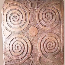 Stone slab with Neolithic spiral relief and pitting, from Tarxien megalithic temples. Photo, Getty Images