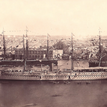 British troopship, probably the Serapis, built in 1866, in harbour with HMS Hercules seen behind. Photo from the Frank-Lea Ellis Collection