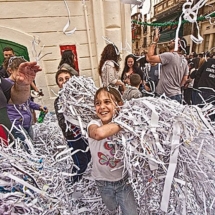 Kids love festas, and all the ticker-tape throwing! Photo Barbara Weibel