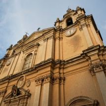 A close up shot of the Cathedral showing the Corinthian style, bell towers and clocks - Photo by Mark Spiteri