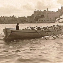 Colonial Memories - Crewmen from HMS Iron Duke row across the Grand Harbour towards Fort St Angelo in the 1920s. Photo courtesy of Bay Retro