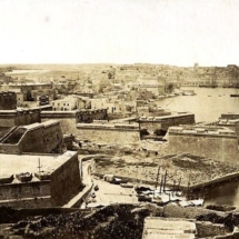 Kalkara - Grand Harbour fortifications extending from Kalkara to Vittoriosa (Birgu). St Angelo rises high to the left of the ship at anchor