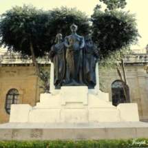 The three statues next to each other signify Courage, Freedom and Religion sculpted by Maltese sculptor Antonio Sciortino