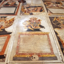 Beautiful marble inlaid tombstones in the Baroque &#039;monument&#039; style, showing military symbols of flags, canons and anchors. Photo, Myriam Thyes