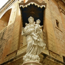 Madonna and Child niche on the corner of the Carmelite Church, Mdina.