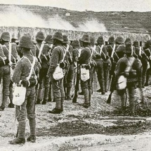 British Army soldiers firing through the musketry loopholes of the Victoria Lines at Tarġa Gap – 1899. Photo Richard Ellis, published in the Navy and Army Illustrated Magazine